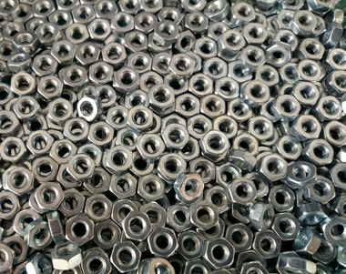 pile-of-silver-hex-nuts-1427292